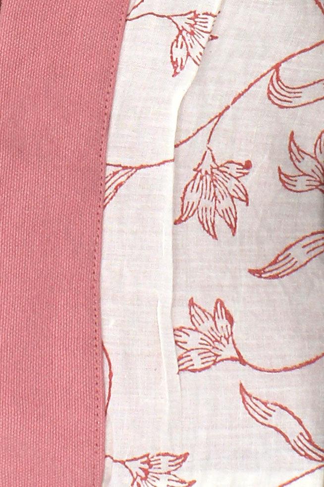 Close-up of pink fabric with floral pattern